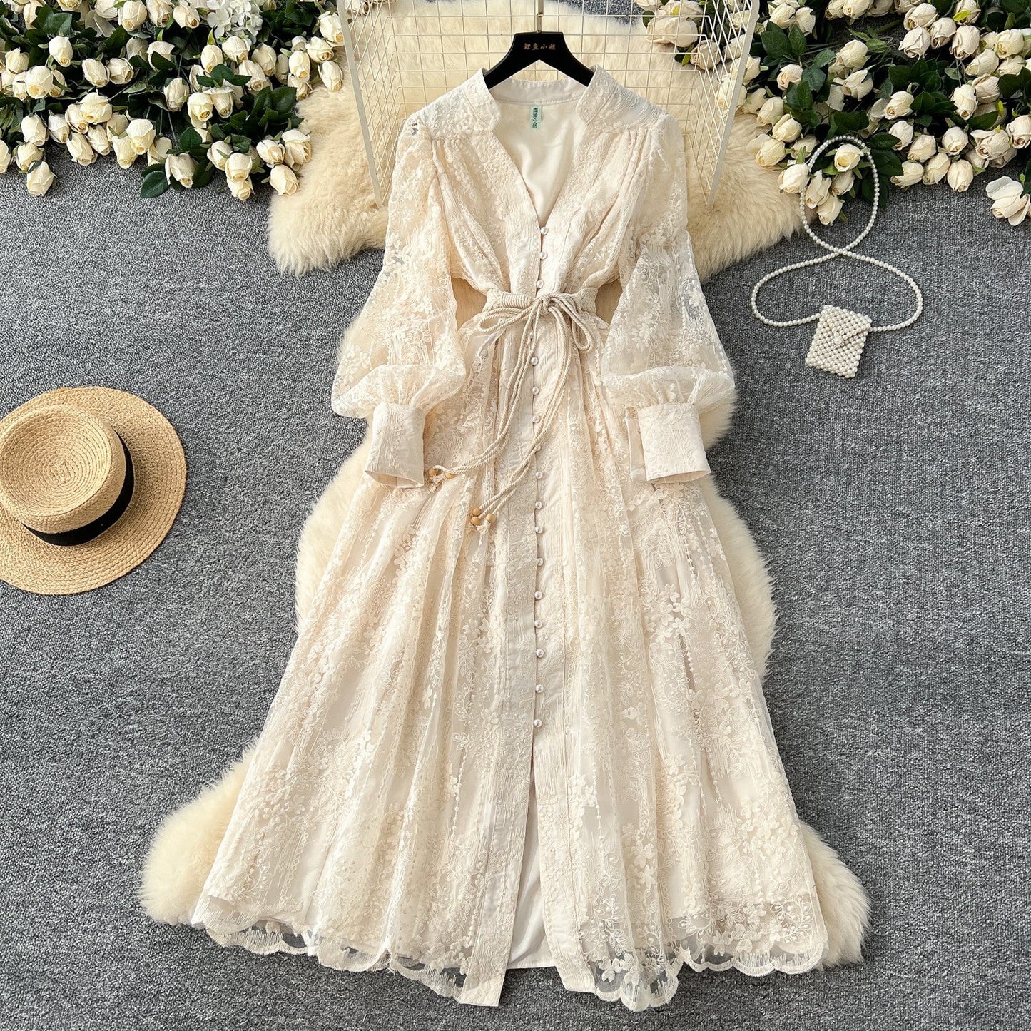 French high-end women's dress for spring 2025 with waist cinching, heavy embroidery, V-neck lantern sleeves, single breasted long skirt