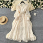 French high-end women's dress for spring 2025 with waist cinching, heavy embroidery, V-neck lantern sleeves, single breasted long skirt