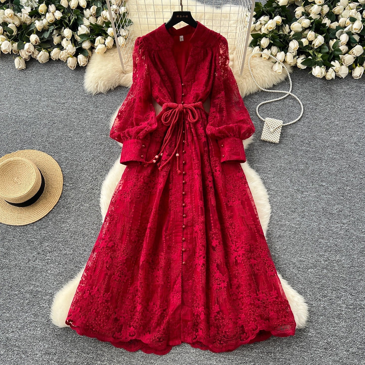 French high-end women's dress for spring 2025 with waist cinching, heavy embroidery, V-neck lantern sleeves, single breasted long skirt