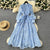 French high-end women's dress for spring 2025 with waist cinching, heavy embroidery, V-neck lantern sleeves, single breasted long skirt